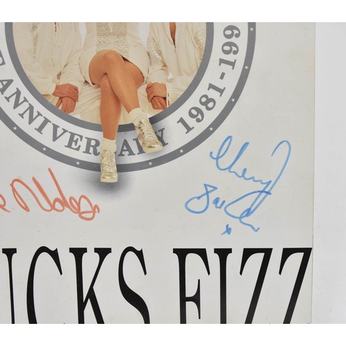 93 - Bucks Fizz Memorabilia, including Tour Programmes ( one signed) and Photo Album with Signatures