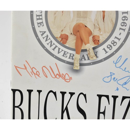 93 - Bucks Fizz Memorabilia, including Tour Programmes ( one signed) and Photo Album with Signatures