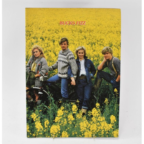 93 - Bucks Fizz Memorabilia, including Tour Programmes ( one signed) and Photo Album with Signatures