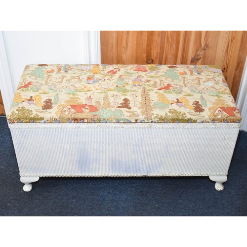 312 - A Lloyd Loom Style Ottoman With Cute Vintage Fabric Top. 93cm x 42cm x 45cm.