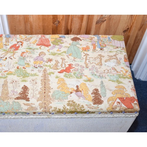 312 - A Lloyd Loom Style Ottoman With Cute Vintage Fabric Top. 93cm x 42cm x 45cm.