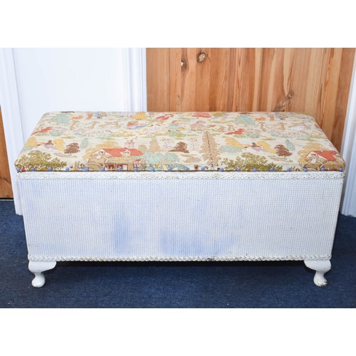 312 - A Lloyd Loom Style Ottoman With Cute Vintage Fabric Top. 93cm x 42cm x 45cm.