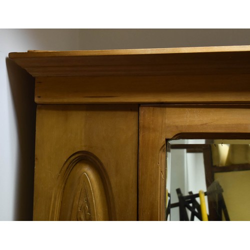 340 - A Pine Breakdown Pine Wardrobe Featuring Carved Detailing, A Mirror And A Drawer.