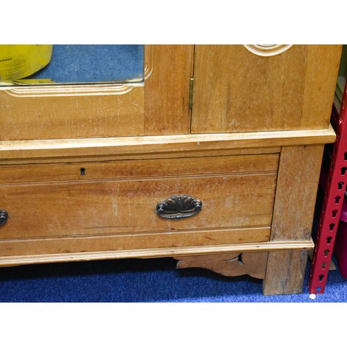 340 - A Pine Breakdown Pine Wardrobe Featuring Carved Detailing, A Mirror And A Drawer.