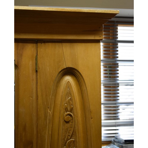 340 - A Pine Breakdown Pine Wardrobe Featuring Carved Detailing, A Mirror And A Drawer.