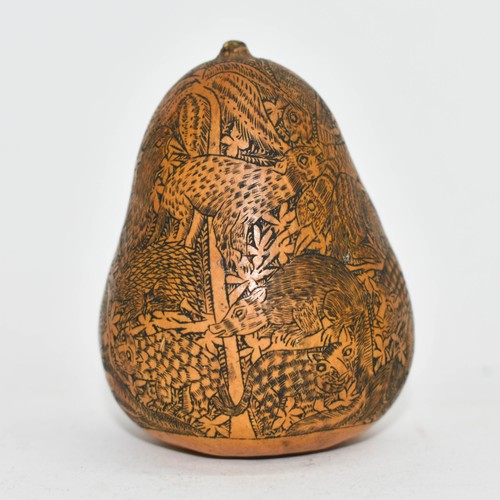 385 - An Antique Highly Carved Gourd