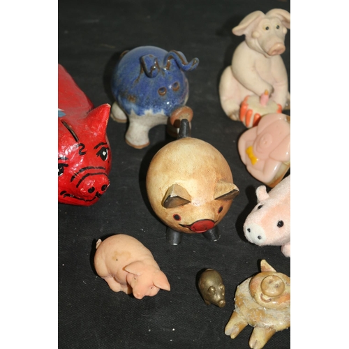 233 - A Collection of Pig Ornaments, Stone Pottery and more