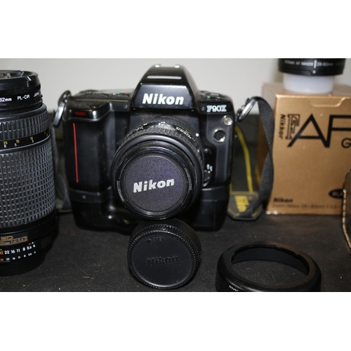 125 - A Nikon P90X SLR Complete with 4 Lenses