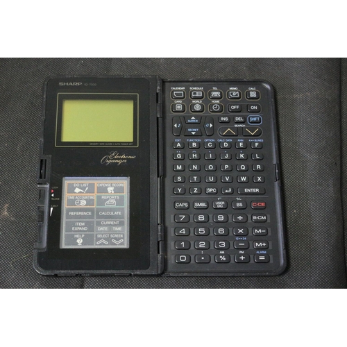 54 - Vintage Sharp Electronic Organiser and Ericsson MC12 Computer 
Untested and No Charging Leads