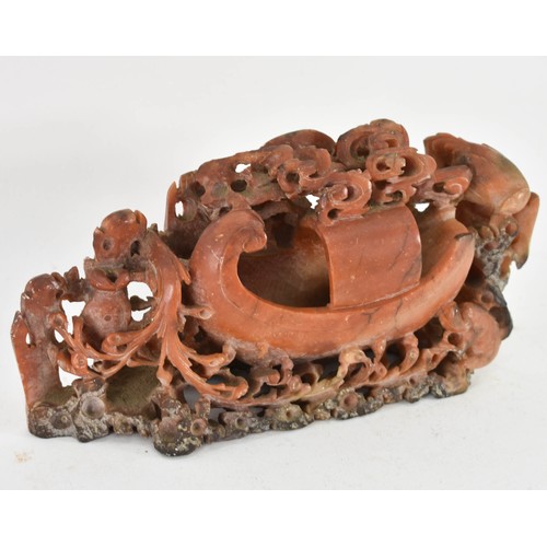 306 - An Intricately Carved Soapstone Sculpture Featuring A Boat. 19cm Length.