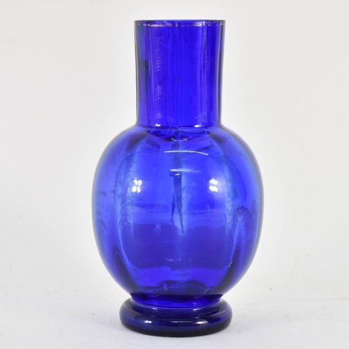 321 - A Mary Gregory Bristol Blue Glass Vase Featuring White Decoration. 11.5cm Height.