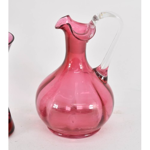 341 - Two Cranberry Glass Items Including A Royal Doulton Vase And Victorian Cranberry Jug (A/F).