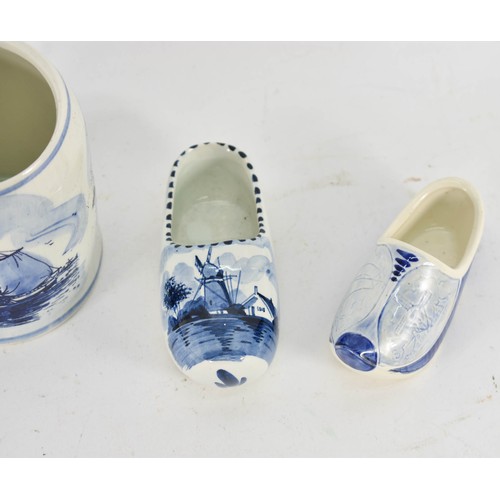 350 - A Collection Of 4 Delfts Blauw Items Depicting Dutch Scenes Including A Cup And Clogs