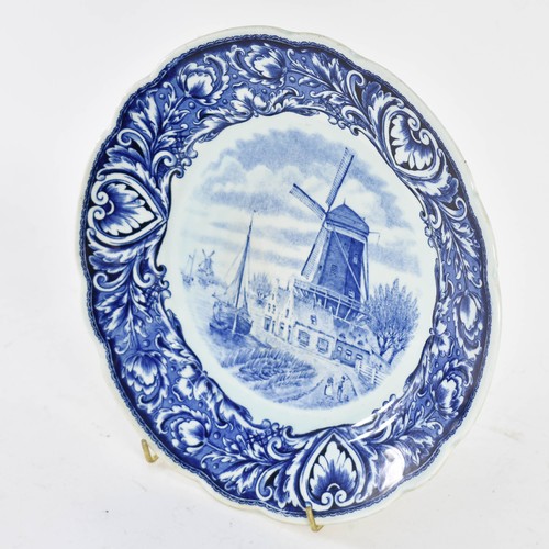 353 - A Delightful Delfts Blauw Wall Plate Featuring A Dutch Windmill Scene. 26cm Diameter.