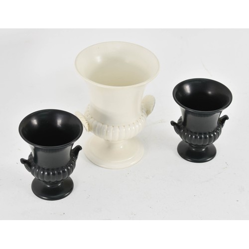 384 - 3 Wedgwod Urns - One White And Two Black. 13cm Height.