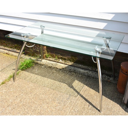 578 - A Glass And Chrome Desk / Table With Undershelf. 140cm x 80cm x 73cm Height.