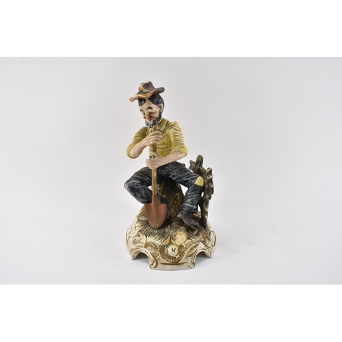 586 - Large Capodimonte Gardener figurine Seated on Bench Standing 30cm Tall