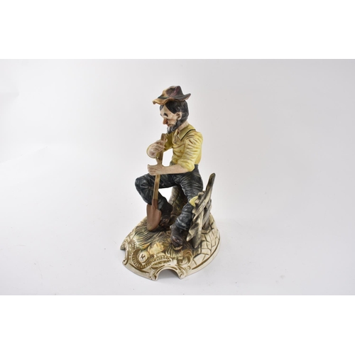 586 - Large Capodimonte Gardener figurine Seated on Bench Standing 30cm Tall