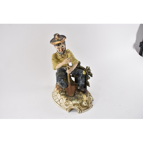 586 - Large Capodimonte Gardener figurine Seated on Bench Standing 30cm Tall