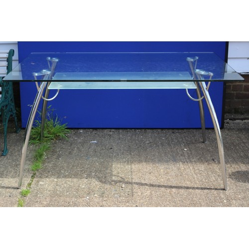 578 - A Glass And Chrome Desk / Table With Undershelf. 140cm x 80cm x 73cm Height.