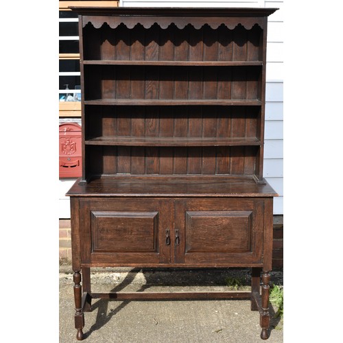 102 - An Antique Welsh Style Dresser With Scalloped Top Detailing