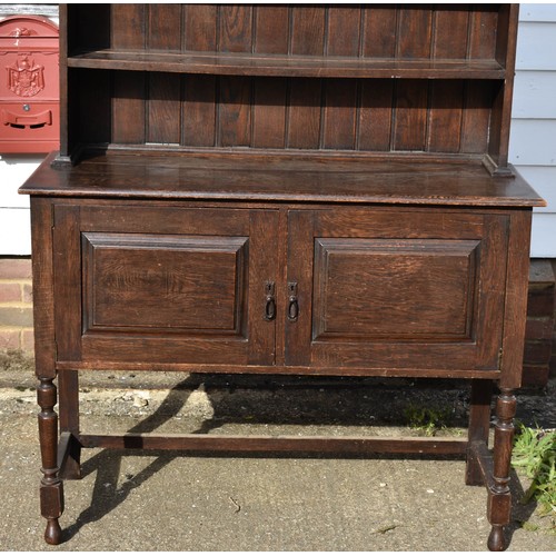 102 - An Antique Welsh Style Dresser With Scalloped Top Detailing