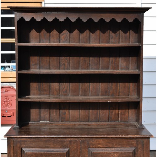 102 - An Antique Welsh Style Dresser With Scalloped Top Detailing