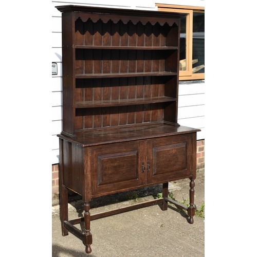 102 - An Antique Welsh Style Dresser With Scalloped Top Detailing