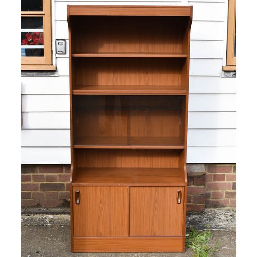 105 - A Tall Mid Century Schreiber Wall Unit Featuring Smoked Glass Doors And A Built In Light