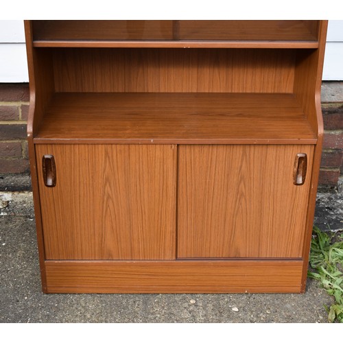 105 - A Tall Mid Century Schreiber Wall Unit Featuring Smoked Glass Doors And A Built In Light