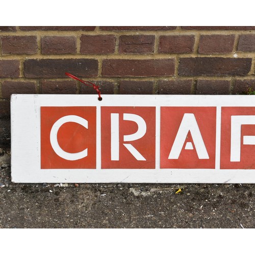 216 - A Large Wooden Craft Shop Sign Featuring Red Lettering. 183cm x 25cm.