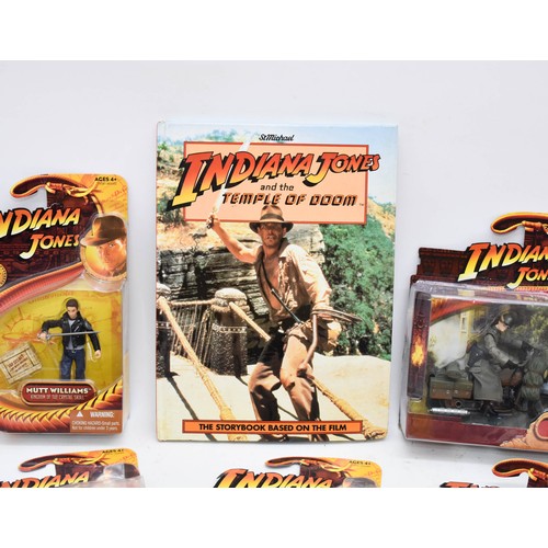 461 - A Collection Of Indiana Jones Boxed Figurines Plus A Book