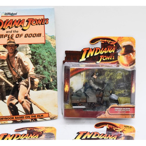 461 - A Collection Of Indiana Jones Boxed Figurines Plus A Book