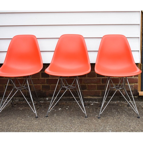 210 - A Collection Of 4 Blood Orange Eames Vitra Chairs Complete With Labels. Eiffel Legs.