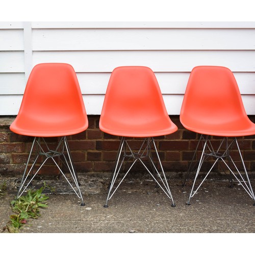 210 - A Collection Of 4 Blood Orange Eames Vitra Chairs Complete With Labels. Eiffel Legs.