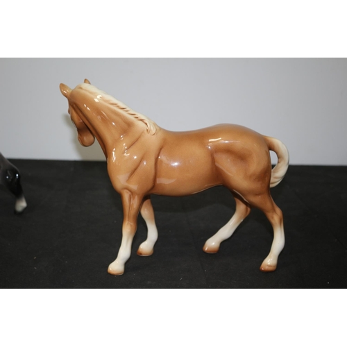 109 - A Beswick Light Brown/Tan Horse 21cm tall repair to one leg A/F