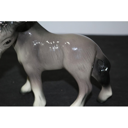 110 - Believed to be a Beswick Donkey 17cm tall