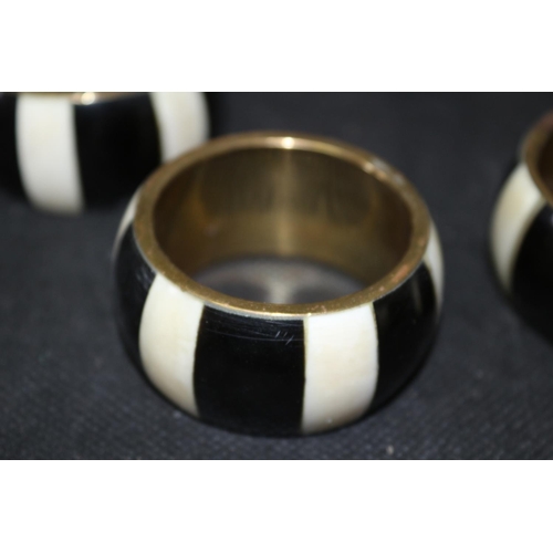 306 - Set of 8 Napkin Rings Brass and Believed to be Ebony and Ivory Inlay