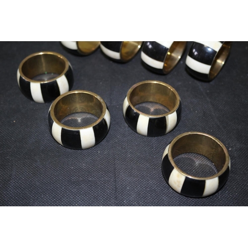 306 - Set of 8 Napkin Rings Brass and Believed to be Ebony and Ivory Inlay