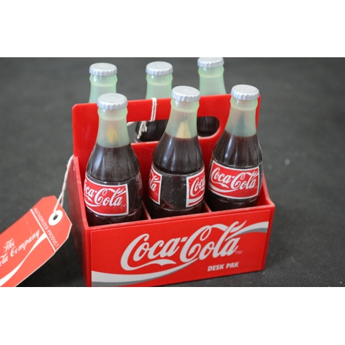 31 - From The Coca Cola Company A Set of 6 Miniature Coca Cola Bottles in a Carrier 9cm tall