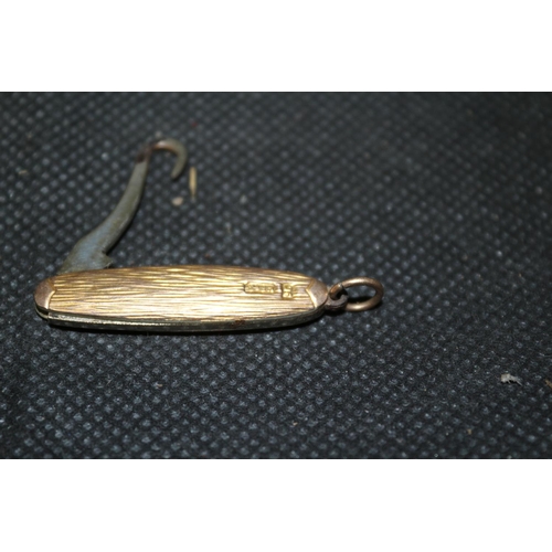 338 - A Small 9ct Gold Covered Hook Puller