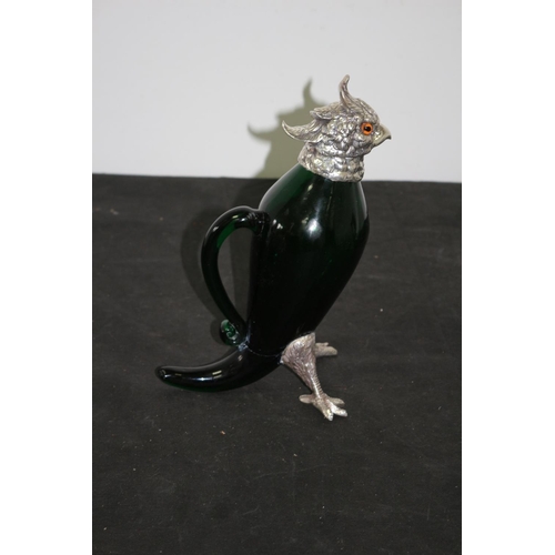 44 - A silver Plated Eagle Head Heavy Green Blown Glass Decanter Standing 28cm Tall. Legs Have been re Gl... 