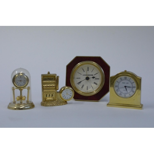 61 - A Collection of Brass Miniature Clocks