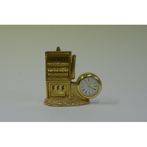 61 - A Collection of Brass Miniature Clocks