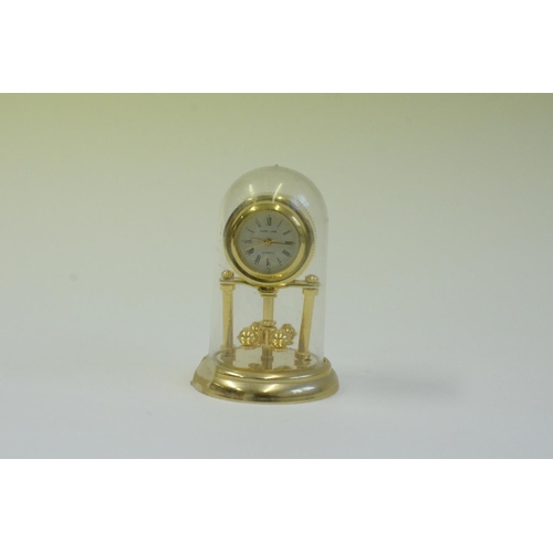 61 - A Collection of Brass Miniature Clocks