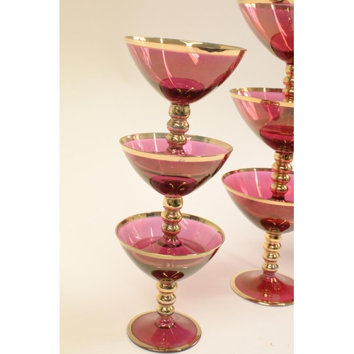 112 - Cranberry Coloured Gold rim Glasses 3 Champagne, 3 Cocktail and 3 Small Glasses