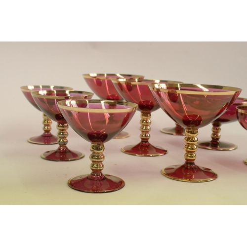 112 - Cranberry Coloured Gold rim Glasses 3 Champagne, 3 Cocktail and 3 Small Glasses