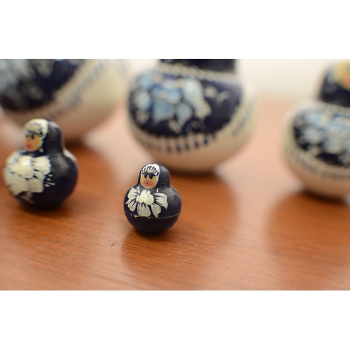 825 - Blue and White Russian Doll with 9 Dolls