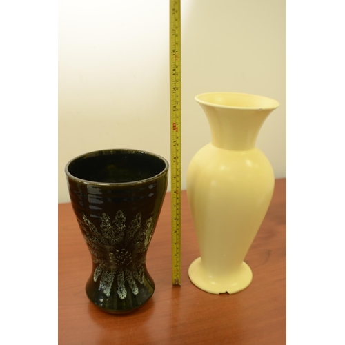 828 - 2 Vases 1 Green with a flower design and the other is Yellow with a small chip in base and on rim