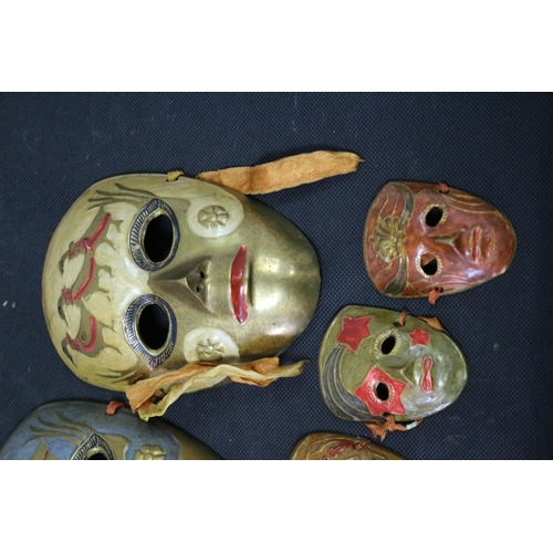 255 - A Selection of Brass Enameled venetian Mask